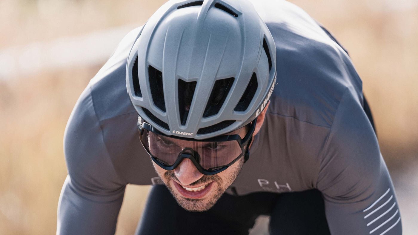 Road cyclist riding in Limar Air Atlas bike helmet and Kosmos sunglasses
