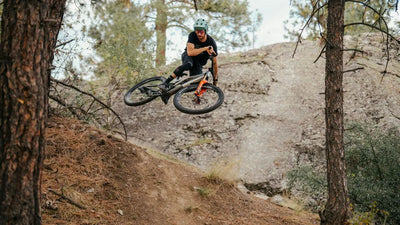 Loam Wolf reviewer riding while wearing Etna helmet