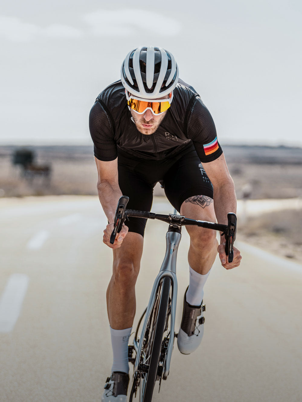 Road cyclist wearing Limar bike helmet